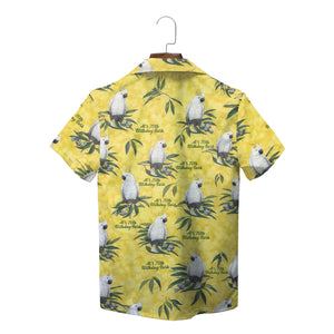 Yellow camp shirt featuring white crested parrots on leafy branches variant 2