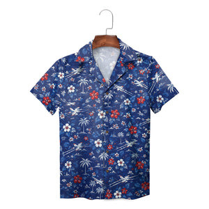 Navy shirt featuring jets, palms, red white blooms