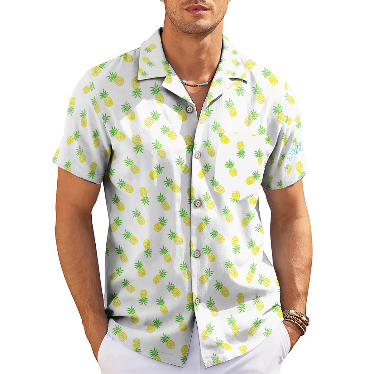 White Hawaiian shirt with yellow pineapple pattern on hanger variant 3