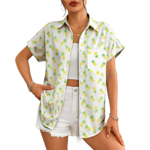 White Hawaiian shirt with yellow pineapple pattern on hanger variant 4