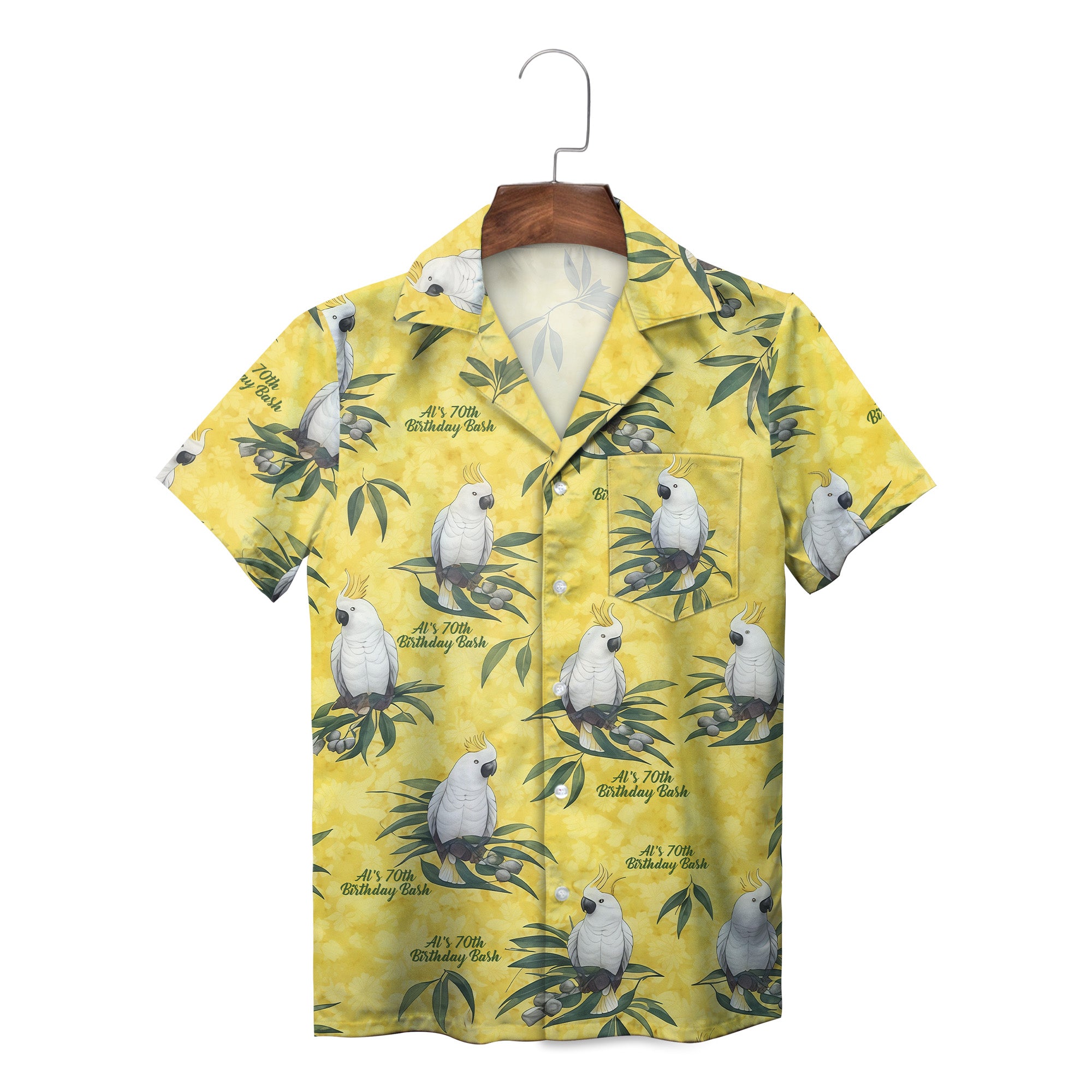 Yellow camp shirt featuring white crested parrots on leafy branches